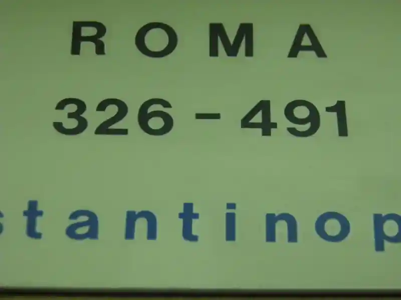 A cross inside a laurel wreath engraved on a gold coin